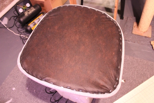 Applying cambric or a dust cover to the bottom of furniture
